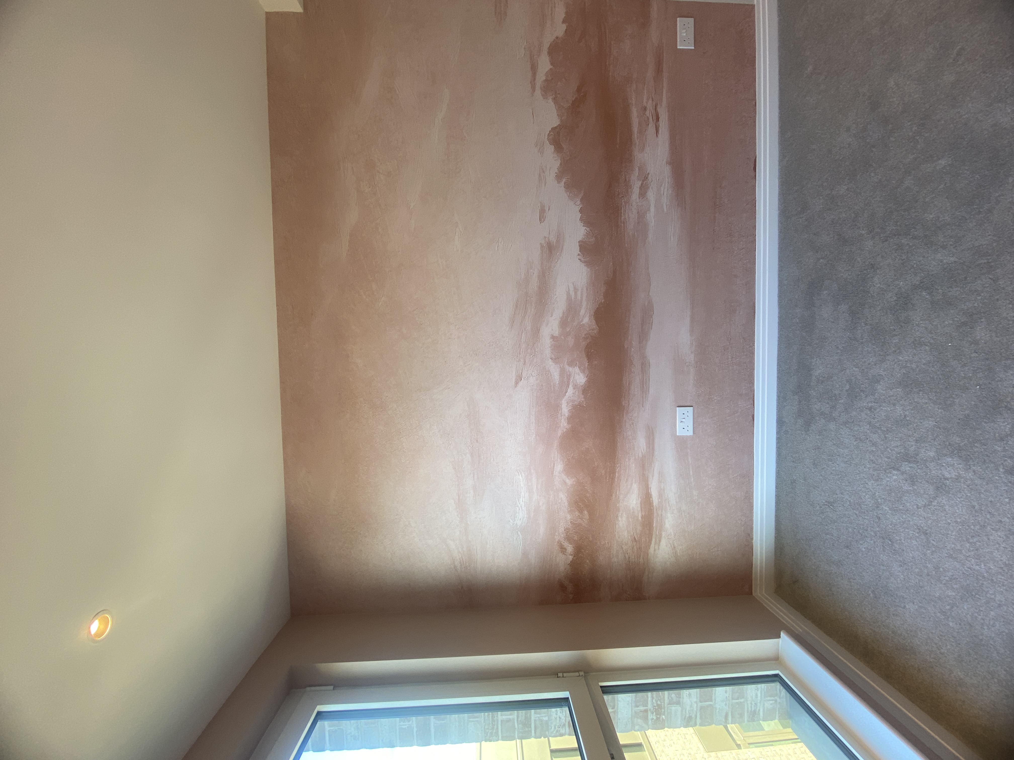Finished pink COAT painted bedroom walls with mural feature wall in progress